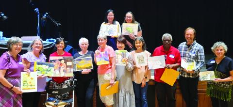Artists with the artwork after the exchange. (CONTRIBUTED)
