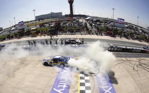 Chase Elliott, driver of the #9 NAPA Auto Parts Chevrolet, celebrates with a sweet burnout after winning the Cup Series DuraMAX Drydene 400 presented by RelaDyne at Dover Motor Speedway Monday. (Tim Nwachukwu/Getty Images)