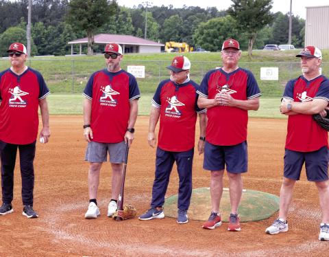 Former Major League Baseball players (l-r) Mike Fischlin, Stephen Drew, Glenn Hubbard, Bruce Benedict and J.D. Drew pose for photos next to Field 3 at the Greene County Recreation Complex during last year’s Fisch Camp. FILE PHOTO