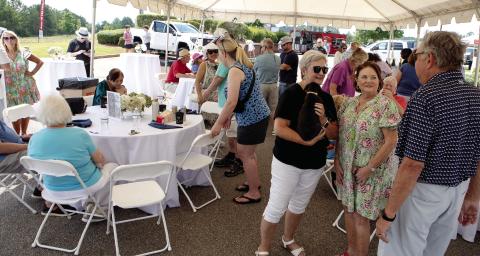 A large, open-sided tent provided much-needed shade and a place to sit down during the Lake Oconee Humane Society benefit event.
