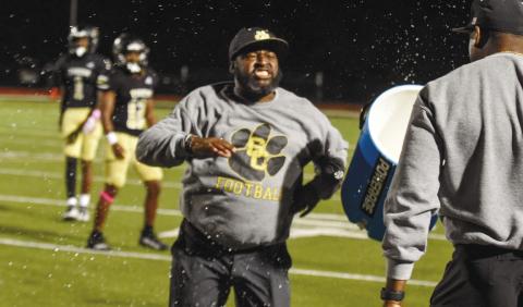 Greene County head coach Terrance Banks got a Gatorade bath last Friday as the Tigers knocked off Lincoln County. LANCE McCURLEY/Staff