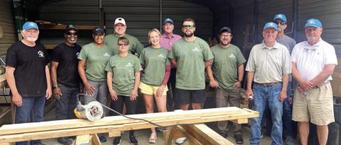 G-P employees help NHN build and deliver kids’ beds. CONTRIBUTED