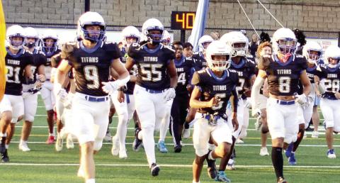 The Lake Oconee Academy Titans take to the field for their home opener this season in Greensboro. IAN TOCHER/Staff