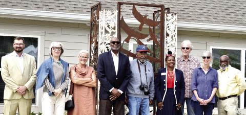 The City of Madison unveiled a sculpture commemorating the historic Jackson Center at Canaan Crossing Sept. 30. Pictured are representatives from apartment complex developer Woda Cooper Companies, the City of Madison, and sculptor Harold Rittenberry (center). (HANNAH BARRON/Staff)
