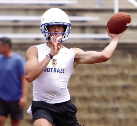 Lake Oconee Academy senior quarterback Ike O’Neal sits in the pocket, ready to fire a pass to a receiver downfield. LANCE McCURLEY/ Staff