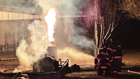 The fire burns off the gas leaking from the propane tank. CONTRIBUTED