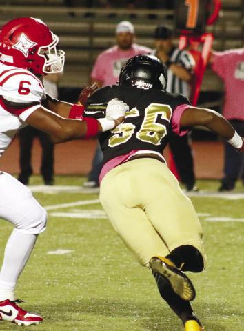 Sophomore Demond Copeland (56) beats a Lincoln County offensive lineman off the edge in the game two weeks ago against the Red Devils. BRENDAN KOERNMER/Staff