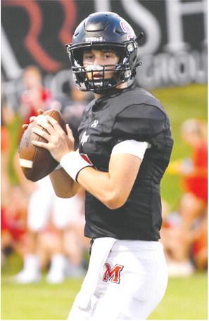 Morgan County sophomore Davis Strickland (5) warms up before entering a scrimmage against Cherokee Bluff in August. He passed for two touchdowns in Friday’s win over Jasper County. LANCE McCURLEY/Staff