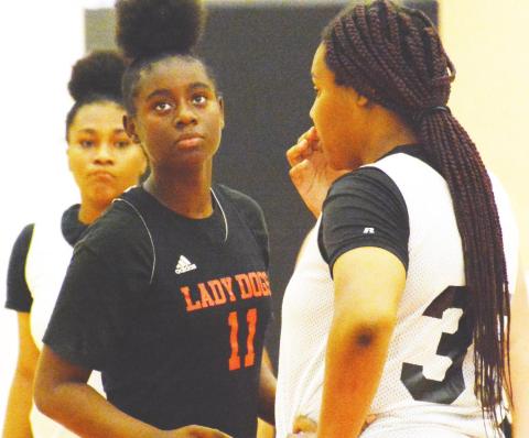Cydney Burke (11) looks over towards the sideline during a timeout in a scrimmage against John Milledge Academy last Tuesday. BRENDAN KOERNER/Staff