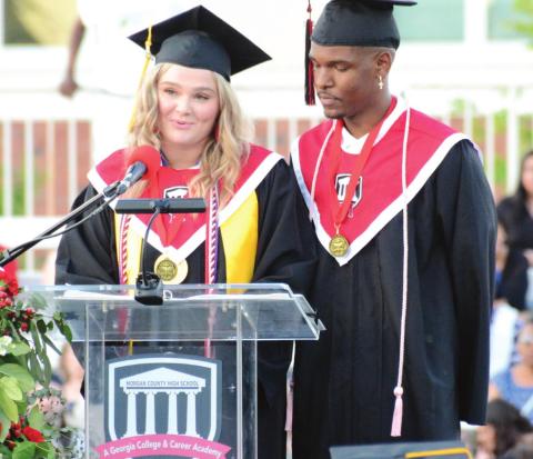 Students speak to their fellow graduates to open the 2022 graduation ceremony at Morgan County High School. BRENDAN KOERNER/Staff