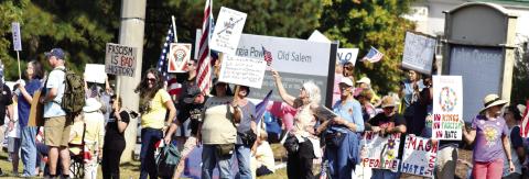 Opponents of Donald Trump’s policies gathered near the intersection of Hwy 44 and Linger Longer Road Oct. 18 to express their dissatisfaction. T. MICHAEL STONE/Staff