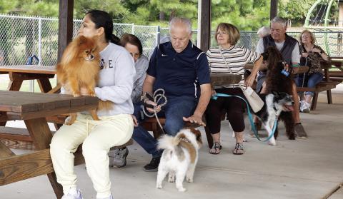 Pets and their people gather Friday for the annual Blessing of the Animals at Christ Our King and Savior Catholic Church in Greensboro. (LEIGH LOFGREN/Staff)