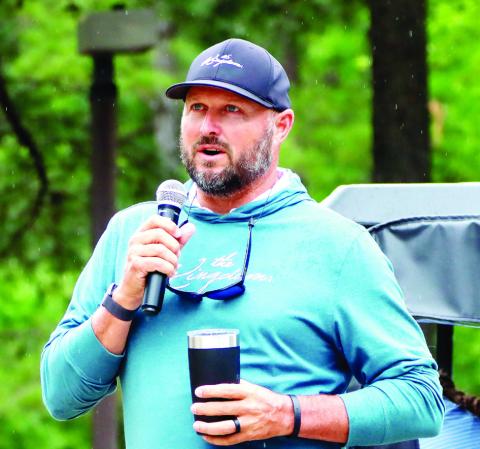 Former PGA golfer and Gatewood graduate Blake Adams shares a devotion before the start of the tournament. (LANCE MCCURLEY/Staff)