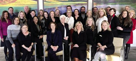 Members of the Heart and Soul Gala Committee, including event chair Riezl Baker (far left), pose with members of the Reynolds Properties team in the operating room waiting area at St. Mary’s Good Samaritan Hospital. CONTRIBUTED