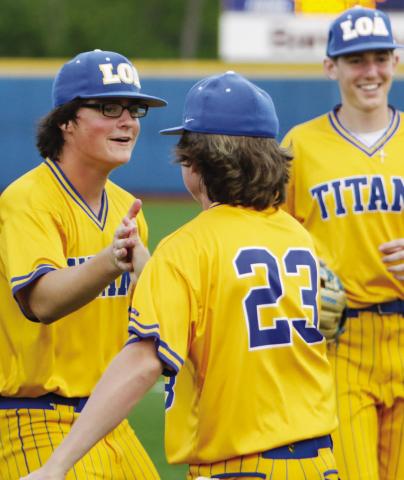 Lake Oconee Academy players celebrate their victory after defeating Towns County 6-1 in game one of a doubleheader on April 1, securing the team’s second-straight Region 8 A Division II title with the win. LANCE McCURLEY/Staff