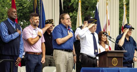 Several leaders from Madison and Loganville pay tribute to fallen soldiers as “Taps” plays near the ceremony’s conclusion. SKYLA MORRIS/Staff