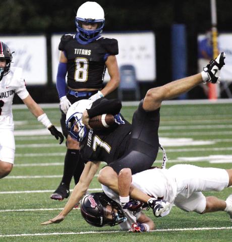 Lake Oconee Academy quarterback Ike O’Neal (7) and senior running back Cameron Kelley (8) have been major contributors to the team’s success on offense this year. WILL MORRISON/File photo
