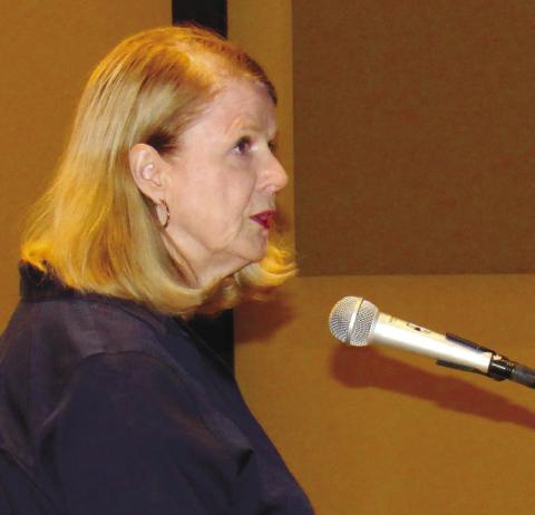 Resident Catherine Harris urged the council to pass a resolution opposing moving court and legal business out of the 174-year-old Greene County Courthouse. MARK ENGEL/Staff