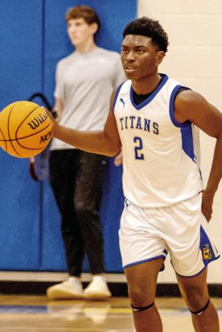 LOA senior Corrion Jernigan brings the ball up the floor during a game against Oglethorpe County on Nov. 25. SKYLA MORRIS/Staff
