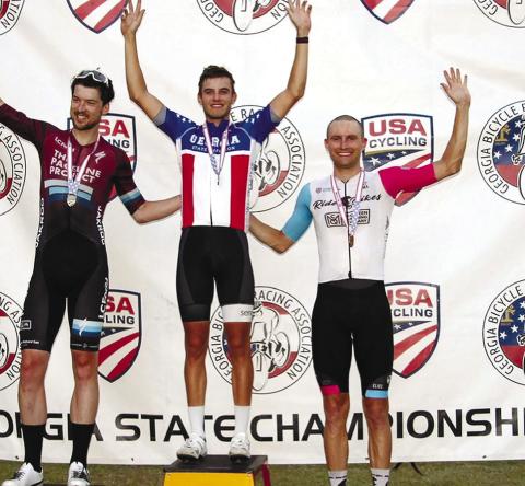 Senoia’s Caleb Landgrebe, winner of the criterium race in the Georgia State Championships last Saturday in Eatonton, stands between second-place finisher Jos Chalmers (left) and third-place Forrest Howard. CALEB LANDGREBE/Photo courtesy Facebook