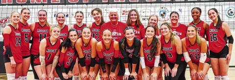 The Spike Dogs pose for a photo after defeating East Jackson on Tuesday, Oct. 22 to advance to the Final Four. CHARLES JORDAN/Staff