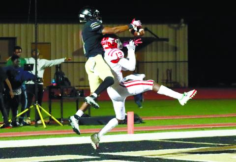 Greene County junior safety Steve Miller (1) makes a play in the end zone by intercepting a Lincoln County pass in last Friday’s 28-3 win over the Red Devils. BRENDAN KOERNER/Staff