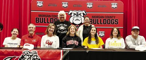 Haedyn Crumbley (front row, fourth from left) and Quinn Butler (front row, third from right) signed with their respective colleges on Dec. 4. CONTRIBUTED