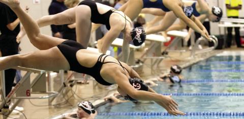 Two Morgan County swimmers dive into the water at the start of a race at the team’s home meet on Jan. 16 SKYLA MORRIS/Staff