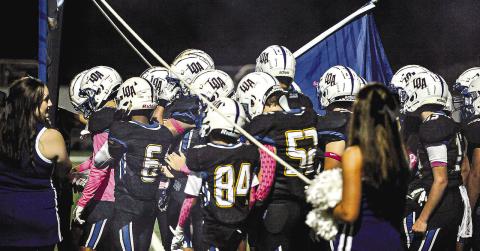 The Titans getting ready to run out onto the field for a region game earlier this season. The team is now has the same amount of wins (6) as they have combined for in the last two seasons (6). CHARLES JORDAN/Staff