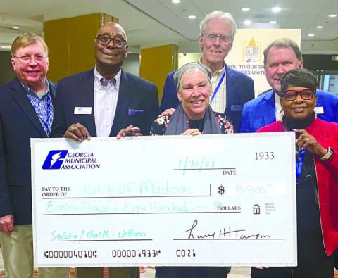 Mayor and Council accept the ceremonial grant check at GMA’s Cities United Summit Jan. 22, 2023. Pictured from left are: John Klimm, City Manager: Fred Perriman, Mayor, Betsy Wagenhauser, Council member; Eric Joyce, Council member; Larry Hanson, GMA CEO; Carrie Peters-Reid, Council member. CONTRIBUTED