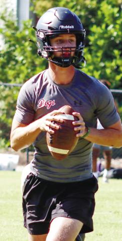 Morgan County quarterback Talan Fuller looks for an open pass-catcher. LANCE McCURLEY/Staff