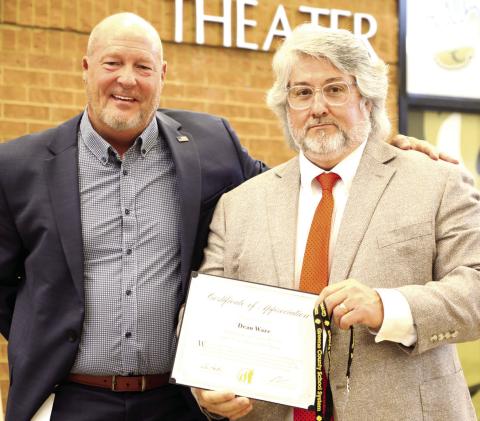 Superintendent Dr. Chris Houston (left) congratulates Dean Ware during the annual end-of-year breakfast. CONTRIBUTED