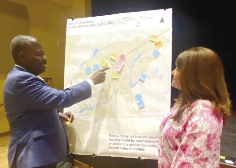 Greensboro City Manager Jarvis Sims identifies housing opportunities to Chamber President Mika Mills. MAUREEN STRATTON/Staff