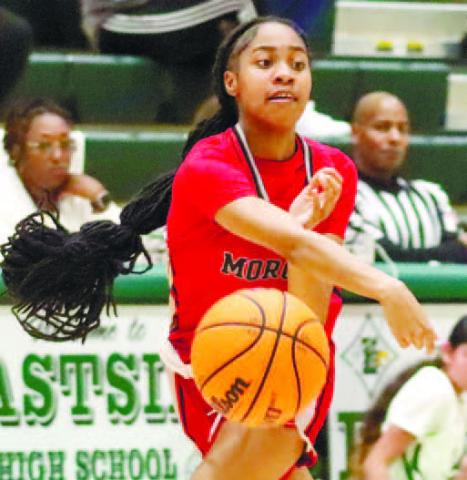 Tanayah Briney (21) bounces a pass inside the paint during a 50-40 win over Eastside on Dec. 17. LANCE McCURLEY/Staff