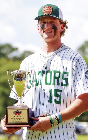 Lawson Wooten holds the 2024 GIAA-2A championship trophy after pitching two scoreless innings on Monday. LANCE McCURLEY/Staff