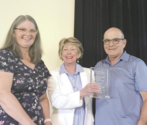 MMCC Volunteer Committee Chair Sally Hoge (left) presented the organization’s Volunteers of the Year award to Kathy and Ed Karpinski for their consistent dedication – rain or shine – to volunteering when needed at every MMCC event. CONTRIBUTED