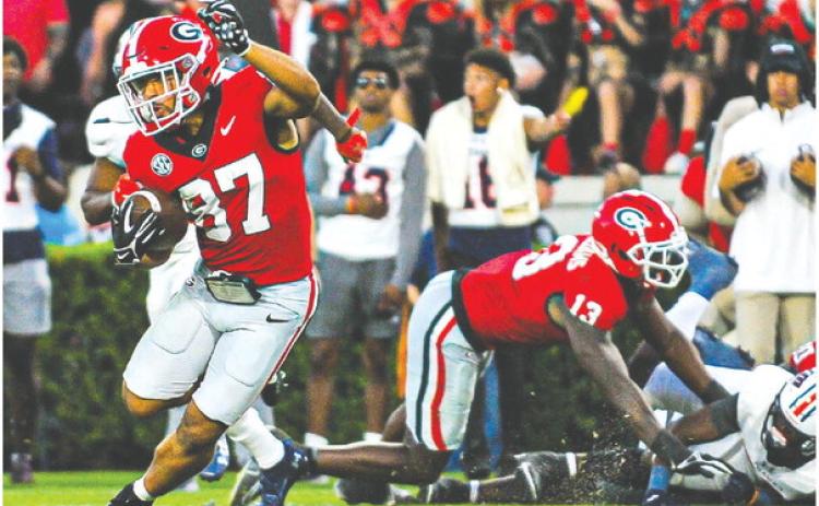 Georgia wide receiver Mehki Mews (87) breaks away from defenders on a 54-yard touchdown during Saturday’s win over UTMartin. CHARLES JORDAN/Contributed