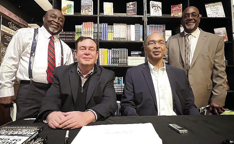 L-R: “Sweet” Lamar, author Tony Barnhart, Charles Turner and Darryl Farley were all members of The 19 of Greene, the first integrated football team in Greene County High School’s history. IAN TOCHER/Staff