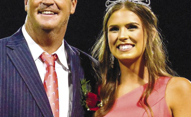 Mary Cate Strickland (right) was named Morgan County's Homecoming queen on Friday night. She was accompanied by her father. LANCE MCCURLEY/Staff