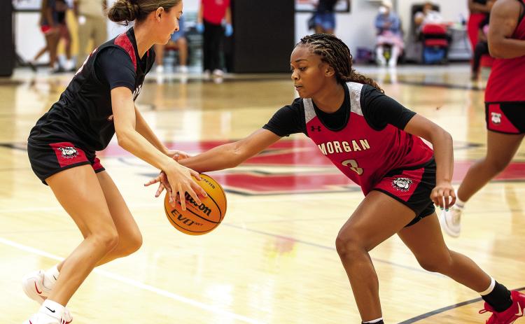 Morgan County’s Addisyn Freeman (3) guards Whitley Crumbley during a recent scrimmage. SKYLA MORRIS/Staff