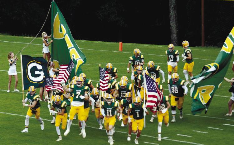 In a game earlier this season, the Gatewood Gators take the field at Sammons Field in Eatonton. IAN TOCHER/File photo