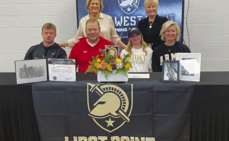 Flanked by her family, Morgan County senior Caroline Jenkins (second from right, front row) recently signed to dive at West Point at the next level. CONTRIBUTED