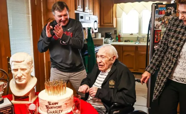 Georgia coach Kirby Smart applauds for Charley Trippi after Trippi blew out all the candles on his cake on his 100th birthday at his home in Athens. Trippi, one of the greatest players and athletes in Bulldogs history, died Wednesday. (Photo by Tony Walsh/UGA Athletics)