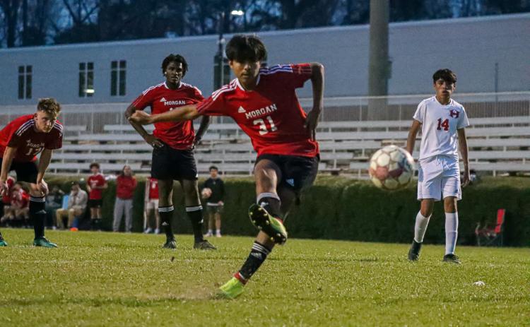 Julian Tenorio (31) takes a shot on goal last year during a win over ARC. LANCE McCURLEY/Staff