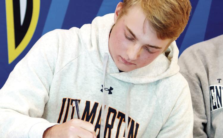LOA senior golfer Drew Williams puts pen to paper Nov. 8, committing to the University of Tennessee-Martin. LANCE MCCURLEY/Staff