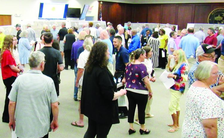 Residents, business owners and community leaders attended the GDOT open house at the Putnam County Administration building on Tuesday, May 7 to see the latest plans for the widening of Highway 44. The project could start early next year. (MARK ENGEL/Staff)