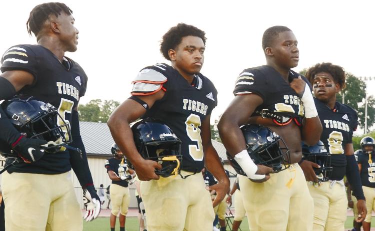 Arkiyus Wright (5, very left) and Malik West (8, very right) we’re two of the team’s captains for their scrimmage game against Putnam County. BRENDAN KOERNER/Staff