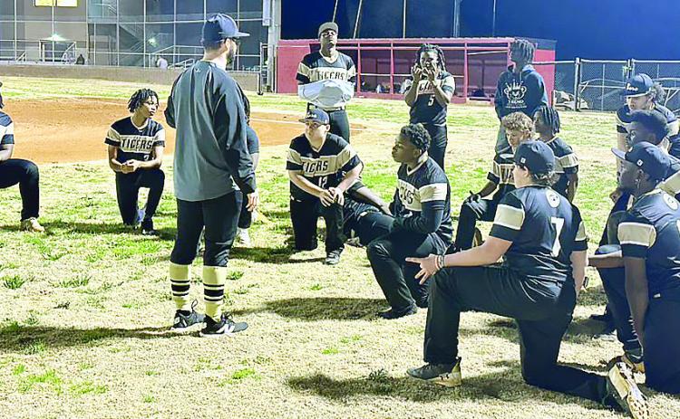 Greene County baseball head coach Brad Evans talks to the team after its close loss to Cross Creek on Feb. 14. CONTRIBUTED