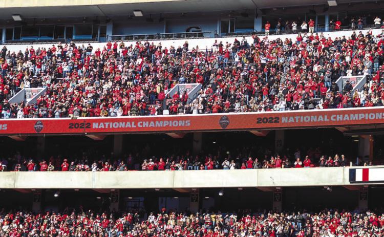 Fans in the upper deck level of Sanford Stadium cheer as the Bulldogs enter Dooley Field. LANCE MCCURLEY/Staff