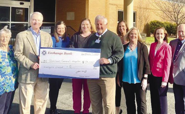 Representatives of the Exchange Bank delivered a $25,000 donation made through the Georgia HEART program earlier this year to Putnam General Hospital CEO Alan Horton (center). CONTRIBUTED